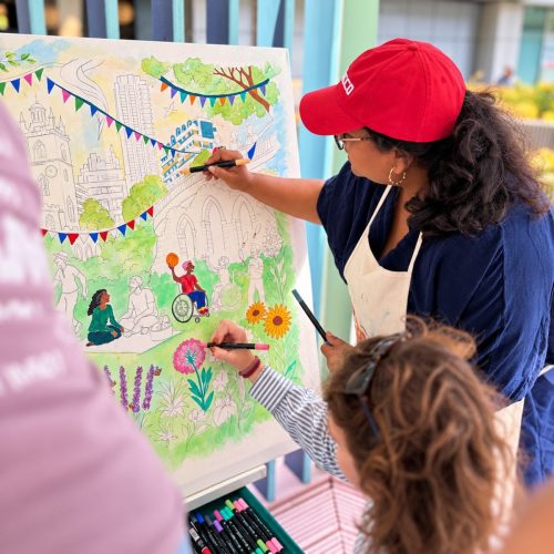 Roopa Basu working with participants on a collaborative public artwork